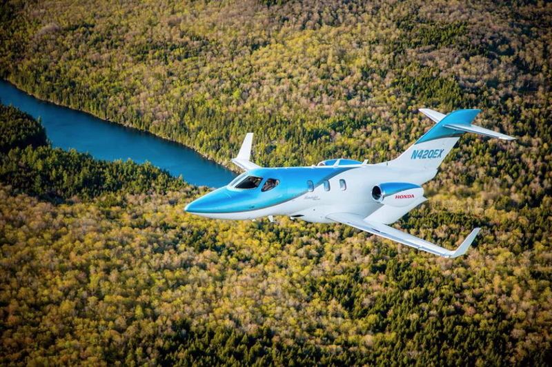 Belted toilet (inside, to rear) flying over Earth vegitation